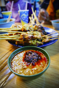 Close-up of dip with meat served in plate