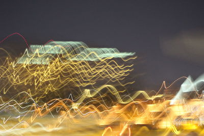 Close-up of illuminated fireworks against sky at night