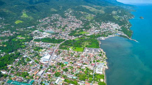 High angle view of townscape by sea