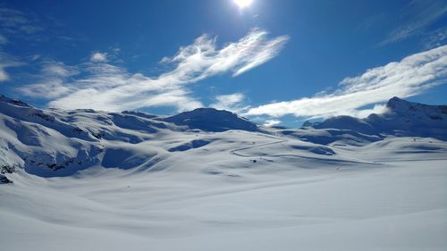 Scenic view of snowcapped mountains against sky