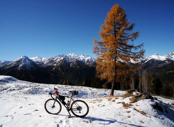 A gravel bike around the dolomites, bike path, ciclying and mountain bike, first snow on the path