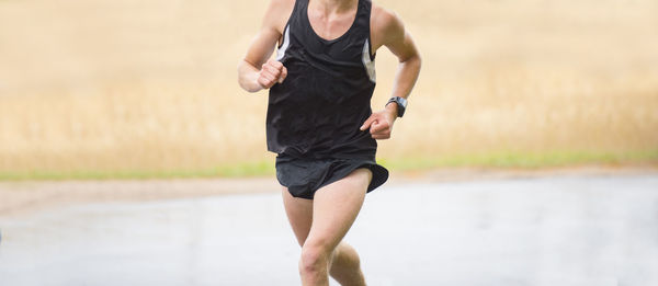 Midsection of woman running