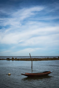 Boat in sea against sky