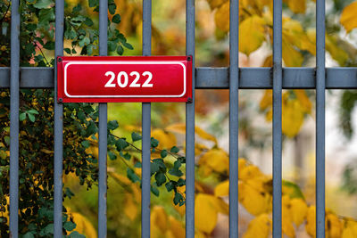 Information sign on metal fence