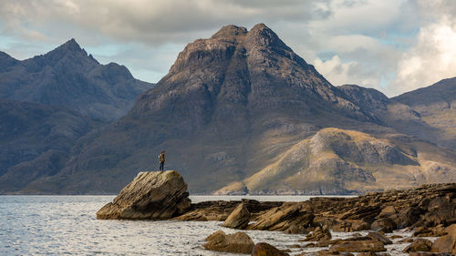 Scenic view of rocks and mountains against sky