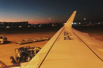 Airplane on airport runway at night