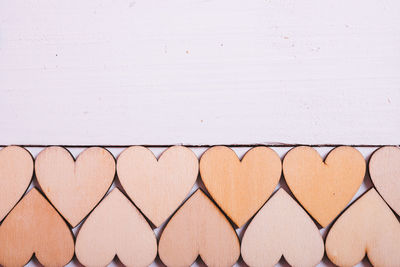 Close-up of heart shape on white wall