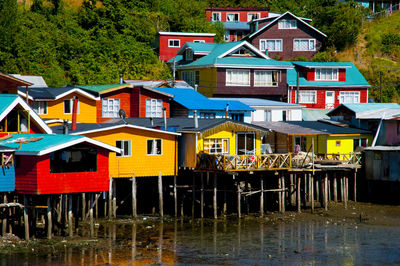 Houses by lake in town