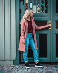 Woman standing in front of door