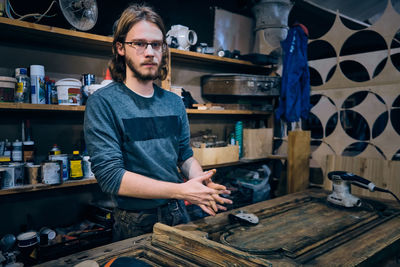 Portrait of man working at workshop