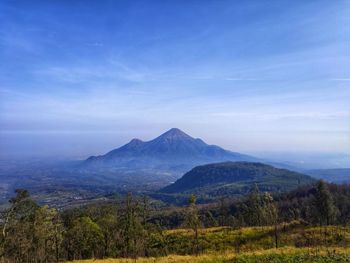 Scenic view of landscape and mountains against sky