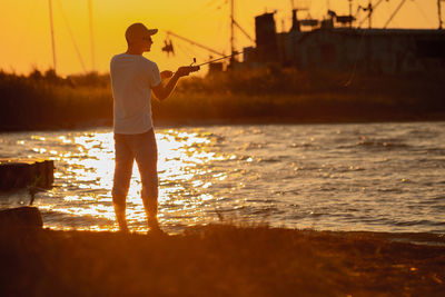 Full length of man standing on sea