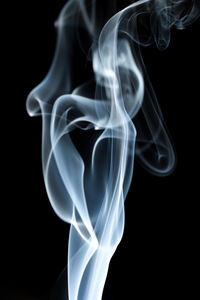 Close-up of smoke against black background