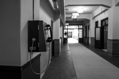Pay phone on wall at corridor