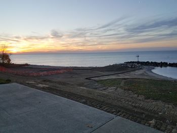 Scenic view of beach against sky during sunset