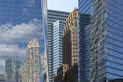 Low angle view of modern buildings against sky