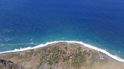 Scenic view of beach against blue sky
