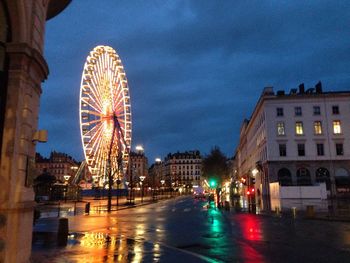 View of illuminated ferris wheel at night