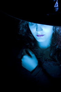 Portrait of young woman wearing hat