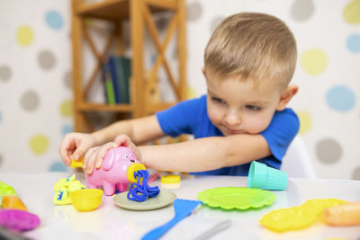 Close-up of boy playing with toys