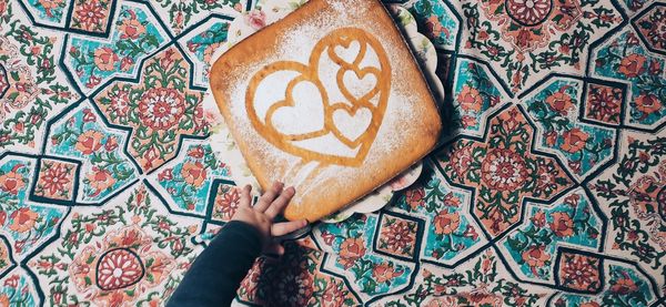 High angle view of hand holding bread