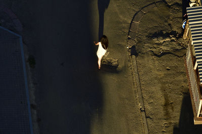 High angle view of woman on wall