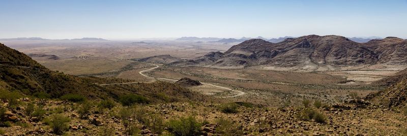 Scenic view of landscape and mountains against sky