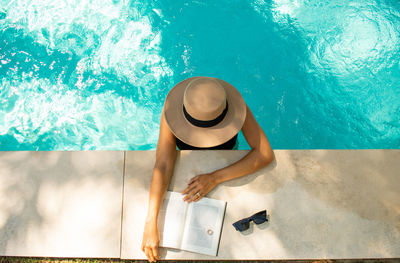 Young girl relaxing in the swimming pool