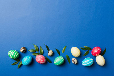 Close-up of christmas decorations on blue background