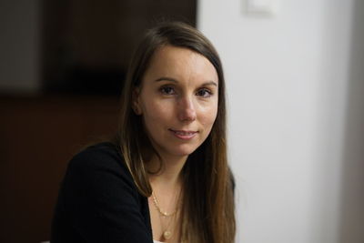 Portrait of young woman at home