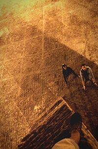 High angle view of shadow on sand at beach