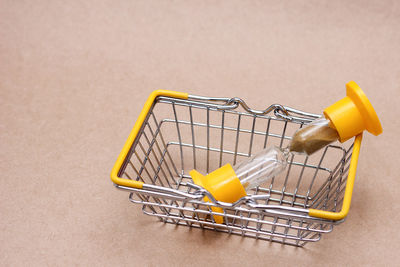 Close-up of shopping cart on table