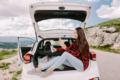 Woman sitting in car