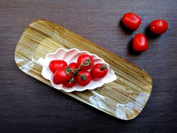 High angle view of strawberries on cutting board