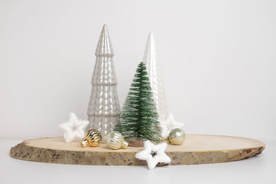 Close-up of christmas decorations against white background