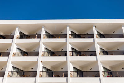 Low angle view of building against clear blue sky