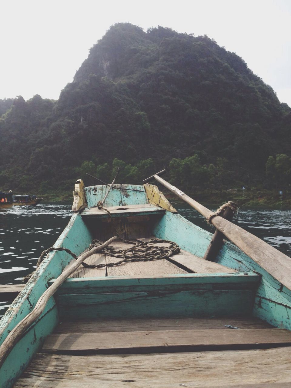 water, mountain, nautical vessel, transportation, boat, pier, built structure, railing, river, scenics, tranquility, lake, clear sky, nature, tranquil scene, mountain range, wood - material, travel