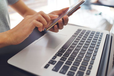 Close-up of woman using mobile phone