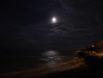 Scenic view of sea against sky at night