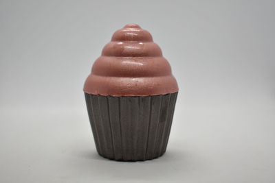 Close-up of chocolate cake against white background