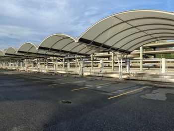 Road by city against sky