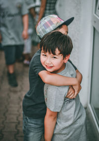 Portrait of cute boy standing outdoors