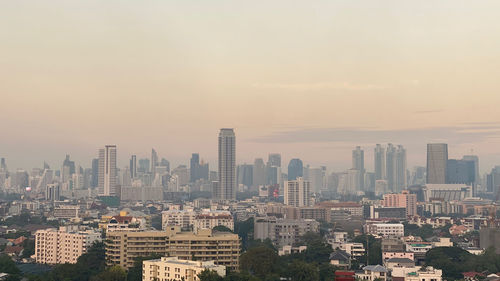 High angle view of buildings against sky during sunset