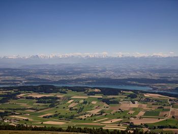 Aerial view of agricultural field against sky