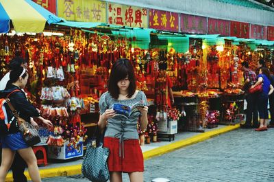 Group of people at market stall