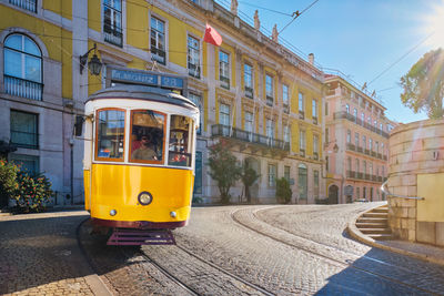 Close-up of car on street in city