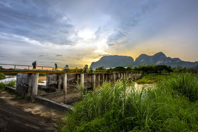 Scenic view of bridge against sky during sunset