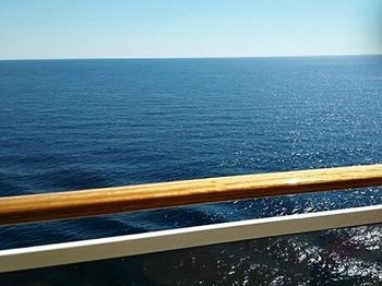 Scenic view of sea against blue sky