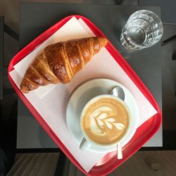 High angle view of cappuccino served on table