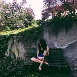 Full length of woman standing on grass